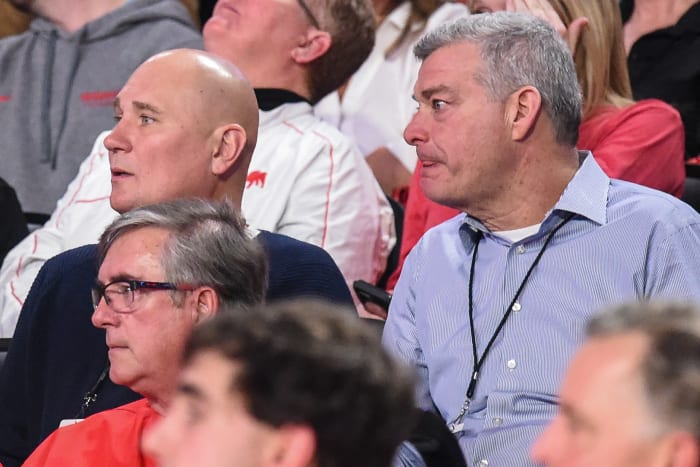 Jan 7, 2020; Athens, Georgia, USA; Atlanta Hawks general manger Travis Schlenk (dark blue shirt at left) and Hawks team owner Antony Ressler (right) watch a game between the Georgia Bulldogs and the Kentucky Wildcats during the second half at Stegeman Coliseum.